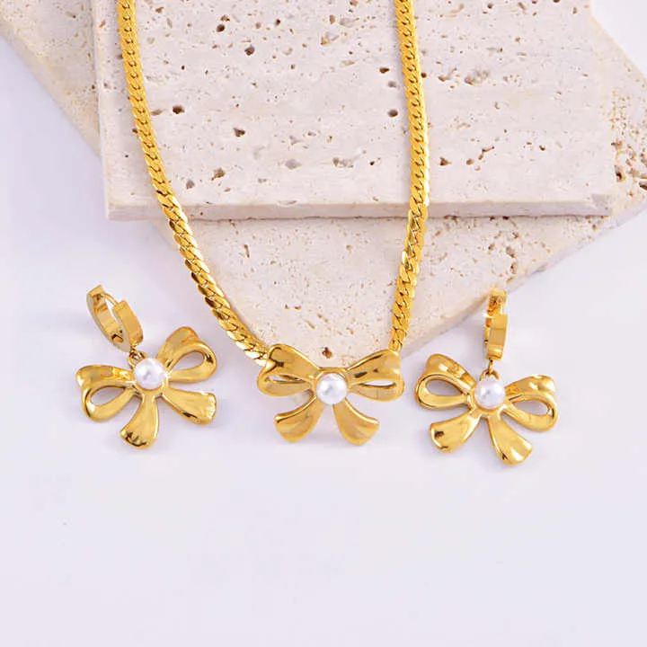 مجموعة أقراط وسوار من اللؤلؤ - New Stainless Steel Pearl Bow Necklace