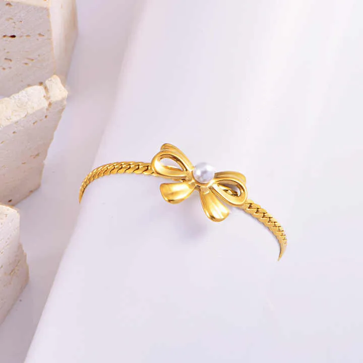 مجموعة أقراط وسوار من اللؤلؤ - New Stainless Steel Pearl Bow Necklace