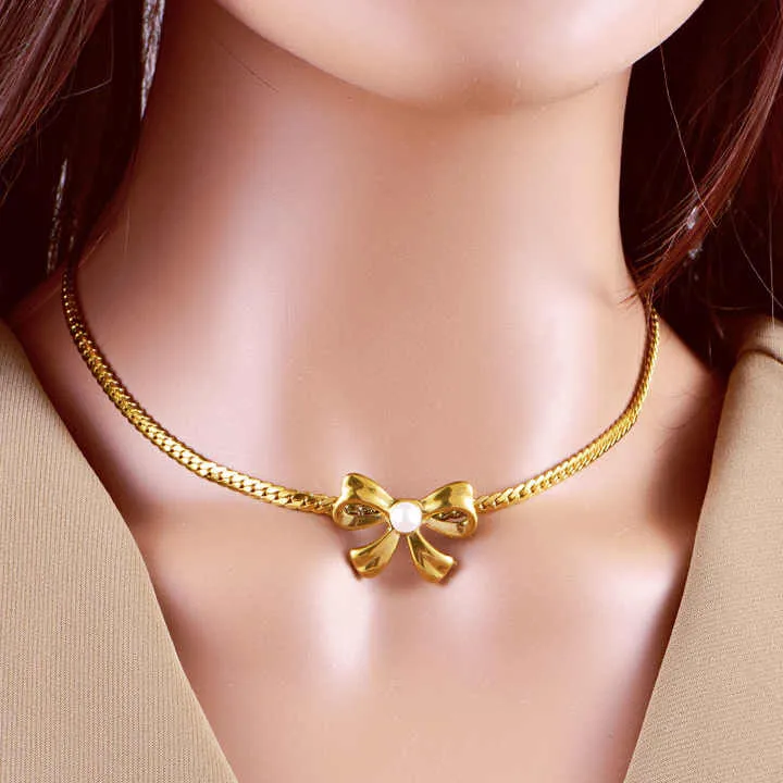 مجموعة أقراط وسوار من اللؤلؤ - New Stainless Steel Pearl Bow Necklace