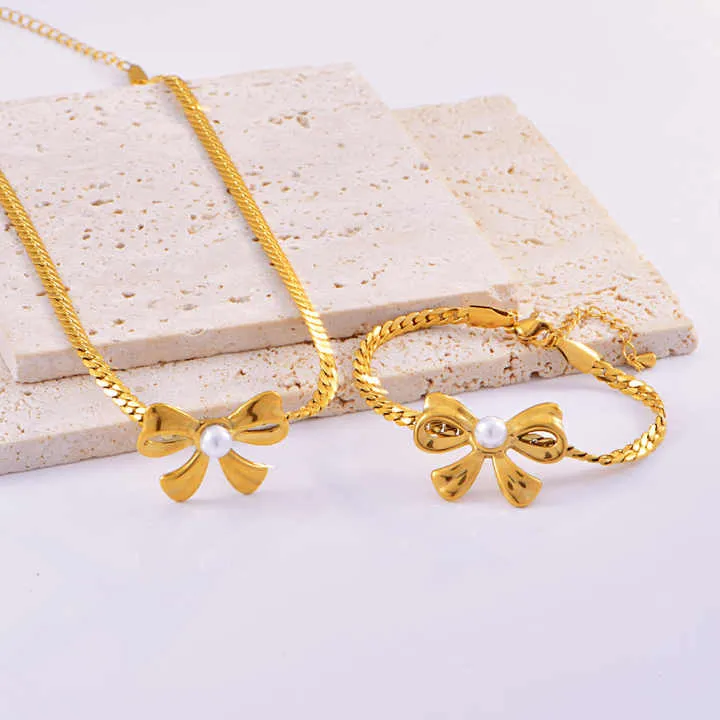مجموعة أقراط وسوار من اللؤلؤ - New Stainless Steel Pearl Bow Necklace